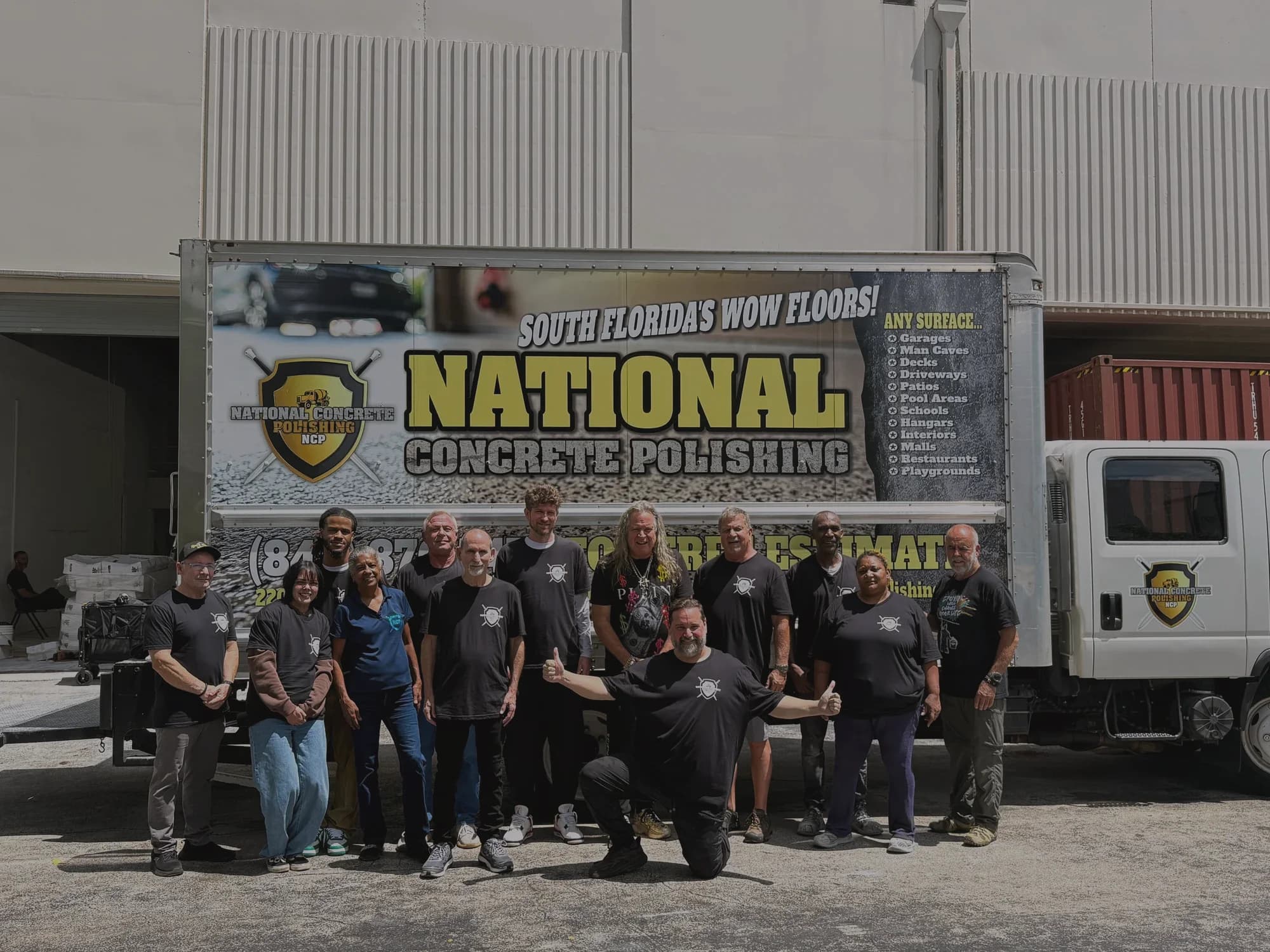 The National Concrete Polishing crew in front of their liveried box truck