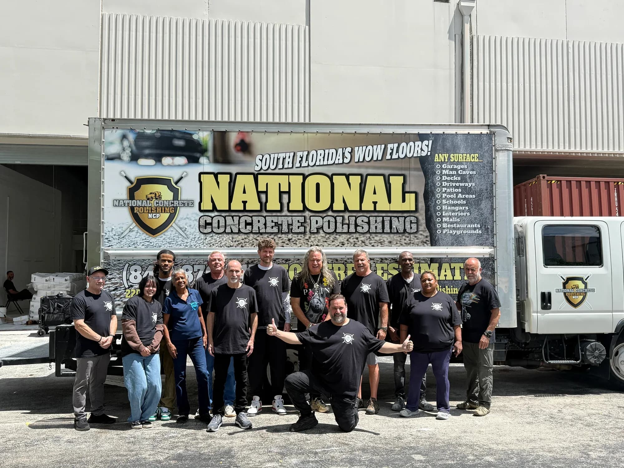 The National Concrete Polishing crew in front of their liveried box truck